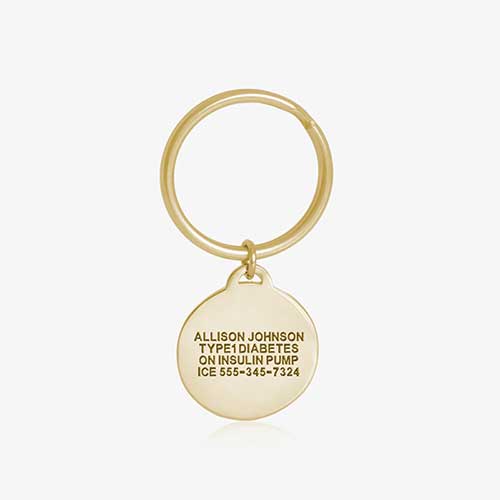 Key ID - gosd tone circular charm showing premium custom engraving on the back side