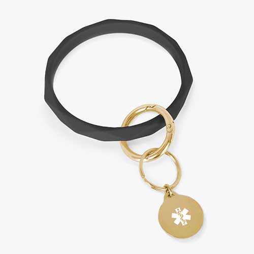 Black faceted silicone medical ID key ring wristlet with gold tone stainless steel medical alert charm.