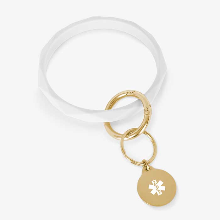 White faceted silicone medical ID key ring wristlet with gold tone stainless steel medical alert charm.