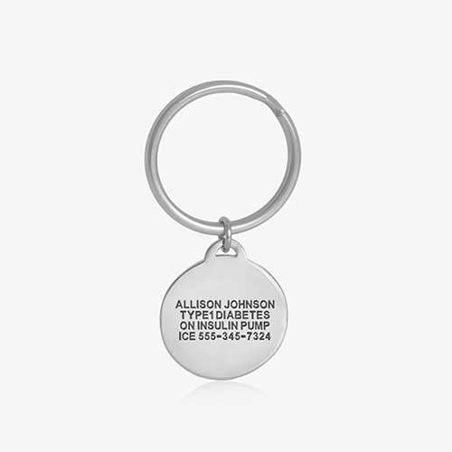 Key ID - silver tone circular charm showing premium custom engraving on the back side